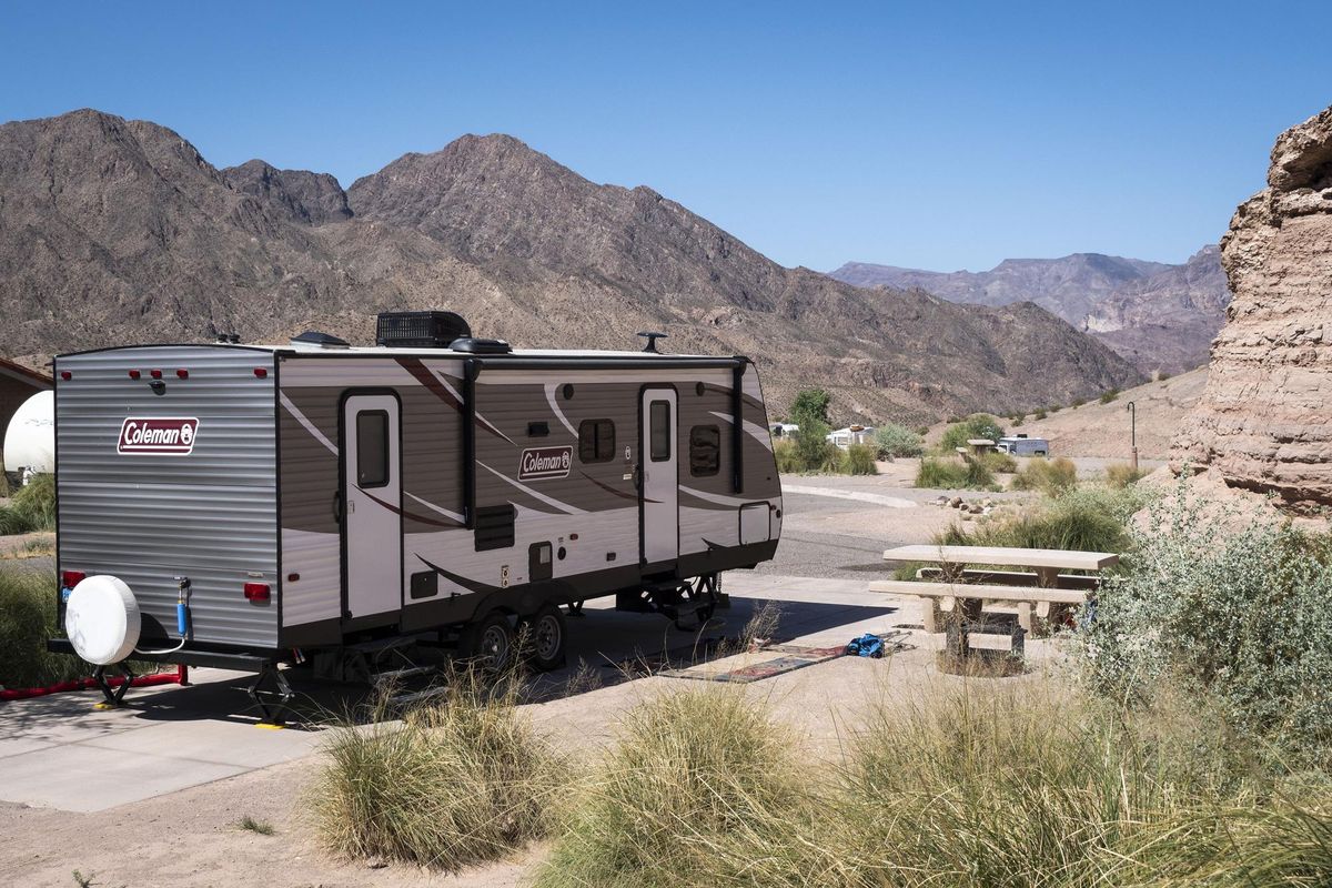 A travel trailer parked at a desert campground at Willow Beach, Lake Mead National Recreation Area