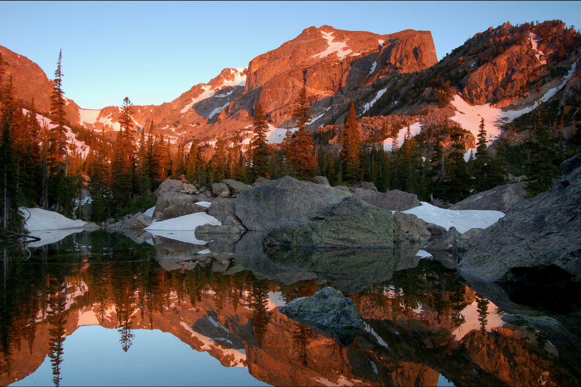 Hallett Peak at dawn reflected in Lake Haiyaha, Rocky Mountain National Park