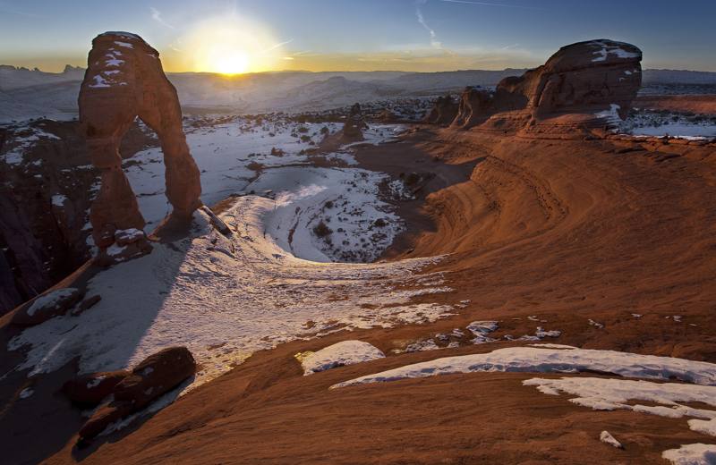 Delicate Arch at sunset with snow on the slickrock, Arches National Park