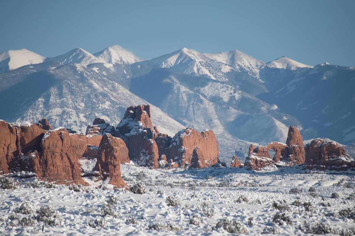 Turret Arch in the Windows Section of Arches with the snowy La Sal Mountains behind