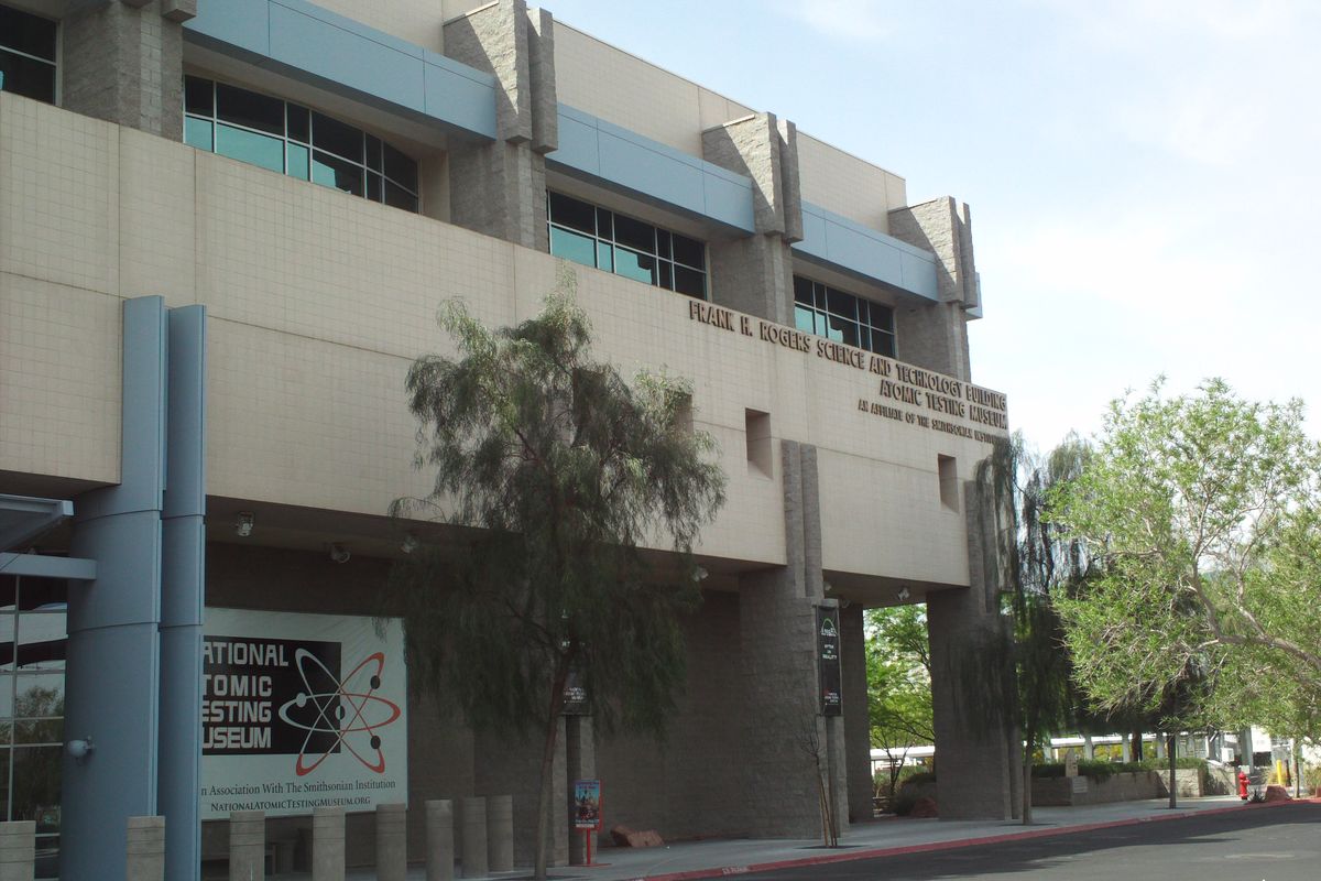 Modern beige building of the National Atomic Testing Museum on East Flamingo Road in Las Vegas, with trees in front